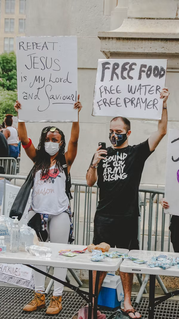 People sharing faith and offering free food, water and prayer